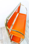 Iconic orange golden 1970s FOLDABLE BAR CART 'Dinett' by Bremshey